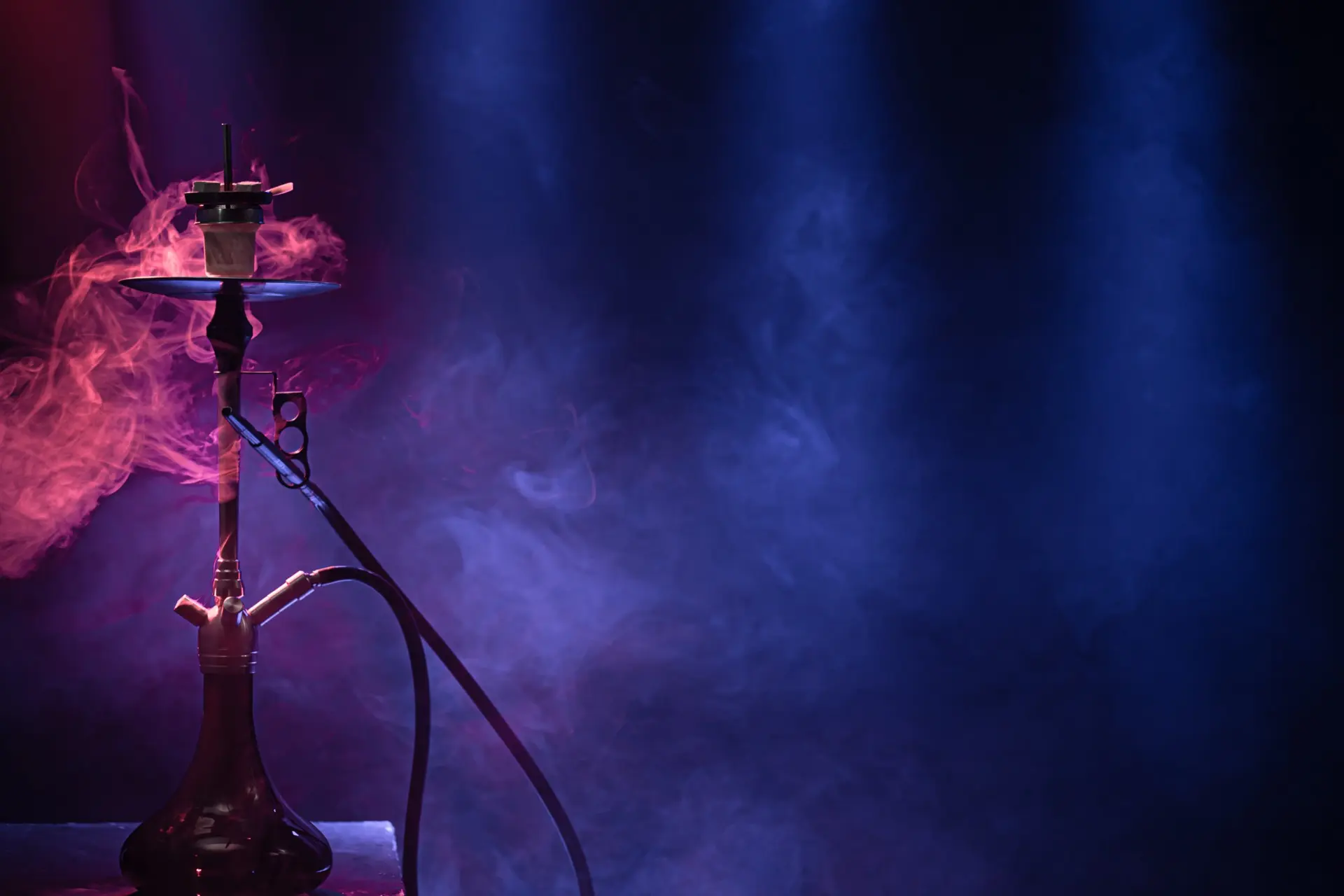 Charcoal N Chill hookah lounge interior in Alpharetta GA — premium VIP Versace seating, ambient lighting, and craft cocktails